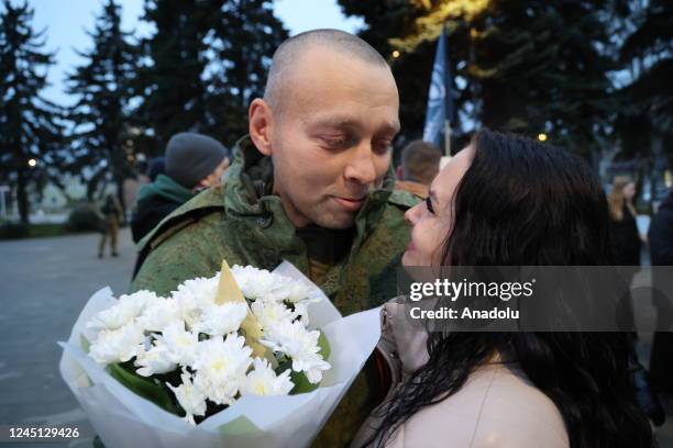Members of the self-proclaimed Donetsk People's Republic reunite with their families after servicemen were released from Ukrainian captivity in...