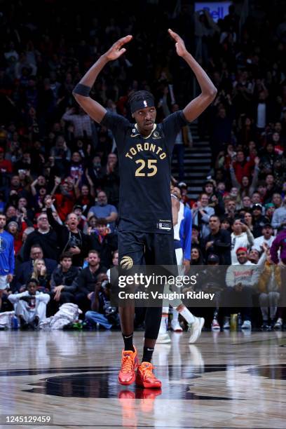 Chris Boucher of the Toronto Raptors celebrates during the game against the Dallas Mavericks on November 26, 2022 at the Scotiabank Arena in Toronto,...
