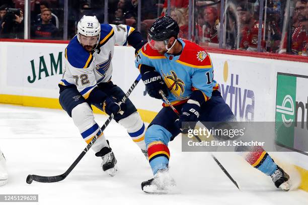 Justin Faulk of the St. Louis Blues gathers the puck against Eric Staal of the Florida Panthers at the FLA Live Arena on November 26, 2022 in...