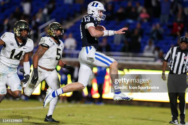 Riley Leonard of the Duke Blue Devils jumps into the end zone as he runs with the ball during a football game between the Duke Blue Devils and the...