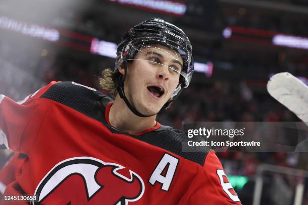 New Jersey Devils center Jack Hughes celebrates after scoring a goal during the National Hockey League game between the Washington Capitals and the...