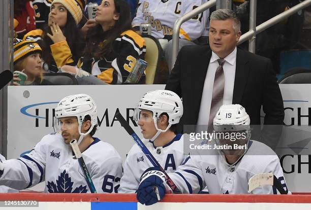 Head coach Sheldon Keefe of the Toronto Maple Leafs looks on from the bench in the second period during the game against the Pittsburgh Penguins at...