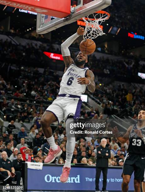 LeBron James of the Los Angeles Lakers dunks against the San Antonio Spurs in the first half at AT&T Center on November 26, 2022 in San Antonio,...