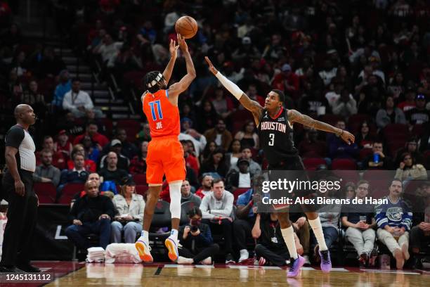 Isaiah Joe of the Oklahoma City Thunder shoots a three point shot over Kevin Porter Jr. #3 of the Houston Rockets during the second quarter of the...