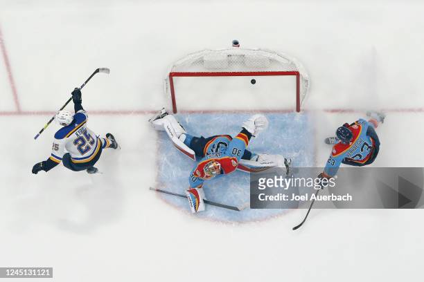 Carter Verhaeghe of the Florida Panthers looks on as Jordan Kyrou of the St Louis Blues raises his stick after scoring the game winning goal in...