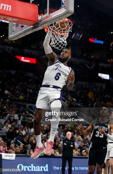 LeBron James of the Los Angeles Lakers dunks against the San Antonio Spurs in the first half at AT&T Center on November 26, 2022 in San Antonio,...