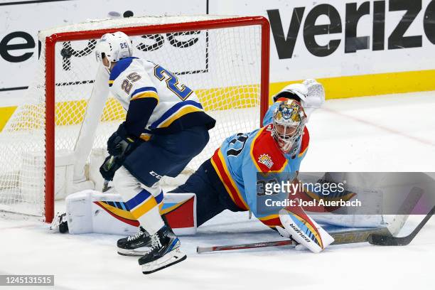 Jordan Kyrou of the St Louis Blues scores the game winning goal in overtime past goaltender Spencer Knight the Florida Panthers at the FLA Live Arena...