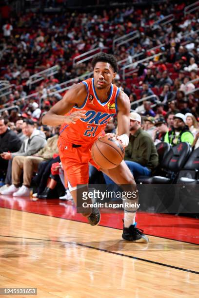 Aaron Wiggins of the Oklahoma City Thunder dribbles the ball during the game against the Houston Rockets on November 26, 2022 at the Toyota Center in...