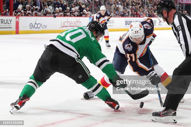 Compher of the Colorado Avalanche faces off against Ty Dellandrea of the Dallas Stars at Ball Arena on November 26, 2022 in Denver, Colorado.