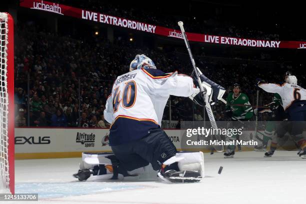 Goaltender Alexander Georgiev of the Colorado Avalanche deflects a puck against the Dallas Stars at Ball Arena on November 26, 2022 in Denver,...