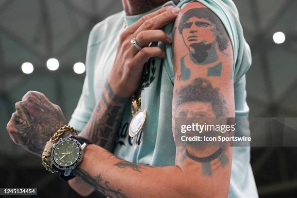 Fan of Argentina shows his tattoo of Messi and Diego Maradona prior to the FIFA World Cup Qatar 2022 group A match between Argentina and Mexico at...