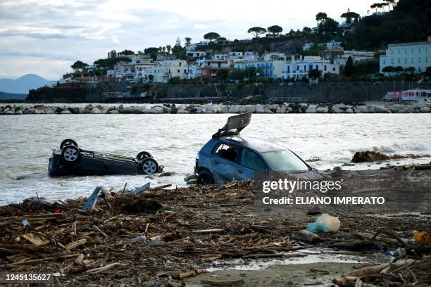 Damaged cars are seen on the beach of Casamicciola on November 27 following heavy rains that caused a landslide on the island of Ischia, southern...