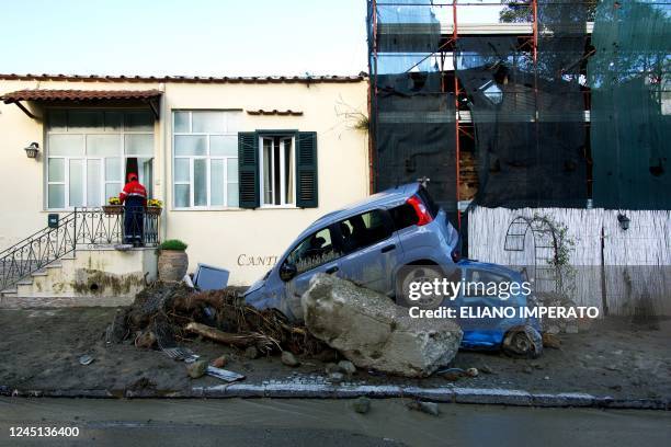 Rescuer checks a damaged house in Casamicciola on November 27 following heavy rains that caused a landslide on the island of Ischia, southern Italy....