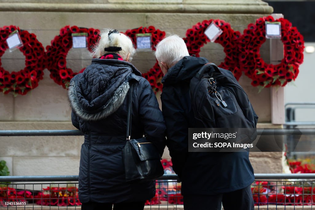 People view the Remembrance Sunday wreaths and poppies...