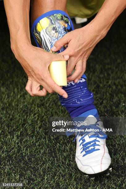 Gaku Shibasaki of Japan puts on his shin pads which feature a Anime Samurai image before the FIFA World Cup Qatar 2022 Group E match between Japan...