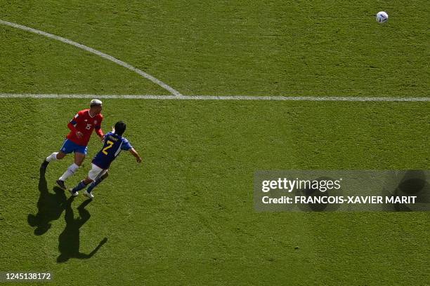 Costa Rica's defender Francisco Calvo fights for the ball with Japan's defender Miki Yamane during the Qatar 2022 World Cup Group E football match...