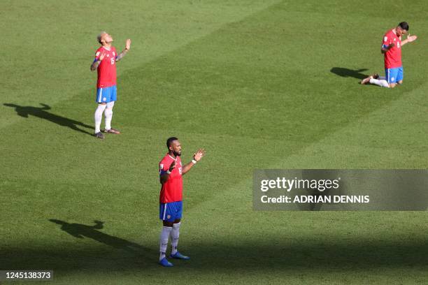 Costa Rica's defender Francisco Calvo , Costa Rica's defender Kendall Waston and Costa Rica's defender Bryan Oviedo pray before second half during...