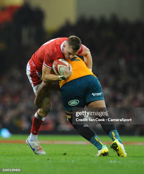 Wales Gareth Anscombe is tackled by Australia's Folau Fainga'a during the Autumn International match between Wales and Australia at Principality...