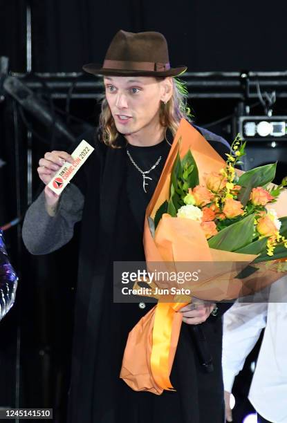 Jamie Campbell Bower receives birthday bouquet during the closing ceremony of Tokyo Comic Con 2022 at Makuhari Messe on November 27, 2022 in Chiba,...