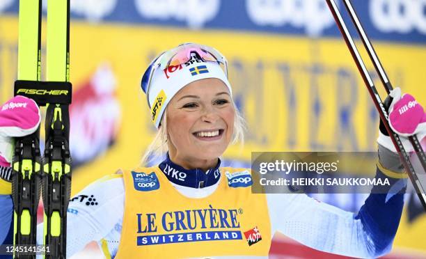 Winner Sweden's Frida Karlsson celebrates after the cross-country 20km pursuit freestyle competition of the Women's FIS Ski Cross-Country World Cup...