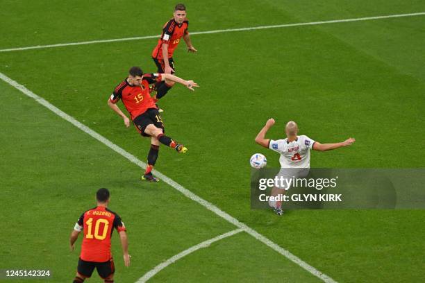 Belgium's defender Thomas Meunier fights for the ball with Morocco's midfielder Sofyan Amrabat during the Qatar 2022 World Cup Group F football match...