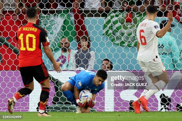 Morocco's goalkeeper Munir Mohand Mohamedi secures the ball during the Qatar 2022 World Cup Group F football match between Belgium and Morocco at the...