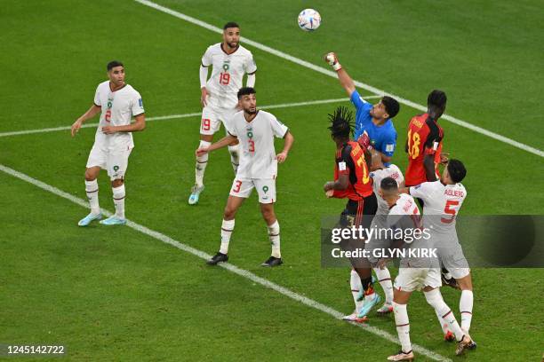 Morocco's goalkeeper Monir El Kajoui deflects a shot during the Qatar 2022 World Cup Group F football match between Belgium and Morocco at the...