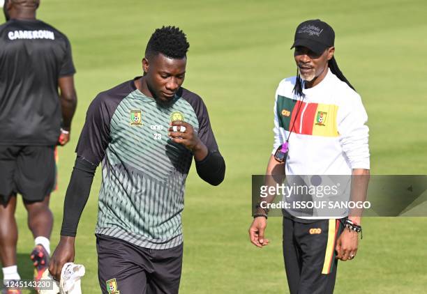 Cameroon's head coach Rigobert Song oversee a training session of his players including Cameroon's goalkeeper Andre Onana on November 27, 2022 at the...