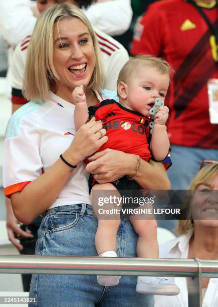 Katrin Kerkhofs, wife of Red Devil Mertens with their young kid at a soccer game between Belgium's national team the Red Devils and Morocco, in Group...