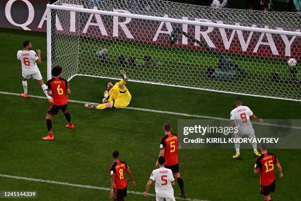 Belgium's goalkeeper Thibaut Courtois concedes a goal shot by Morocco's midfielder Abdelhamid Sabiri during the Qatar 2022 World Cup Group F football...