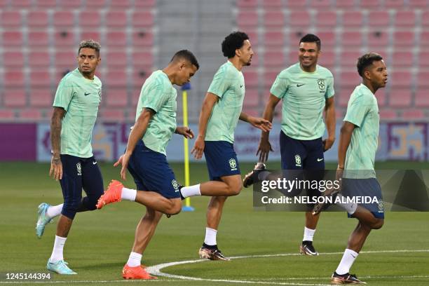 Brazil's forward Raphinha, Brazil's defender Thiago Silva, Brazil's defender Marquinhos, Brazil's midfielder Casemiro attend a training session with...