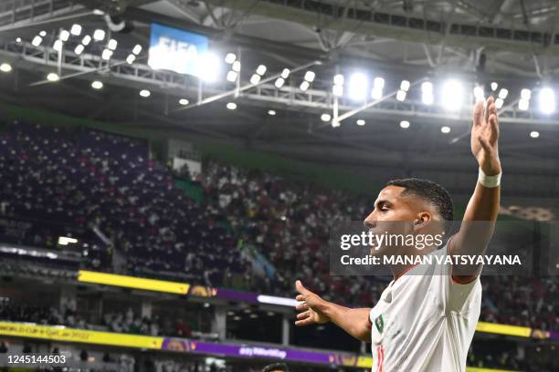 Morocco's midfielder Abdelhamid Sabiri celebrates after he scored his team's first goal during the Qatar 2022 World Cup Group F football match...