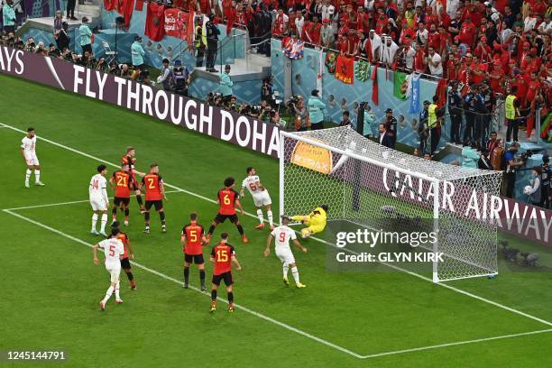 Belgium's goalkeeper Thibaut Courtois concedes a goal shot by Morocco's midfielder Abdelhamid Sabiri during the Qatar 2022 World Cup Group F football...