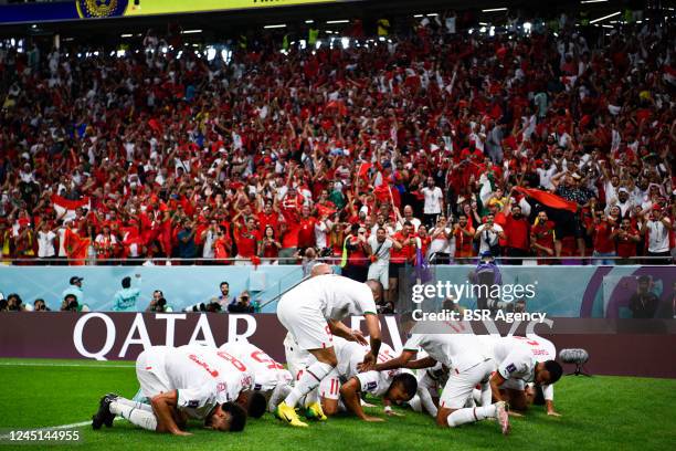 Abdelhamid Sabiri of Morocco celebrates with teammates after scoring their team's first goal during the Group F - FIFA World Cup Qatar 2022 match...