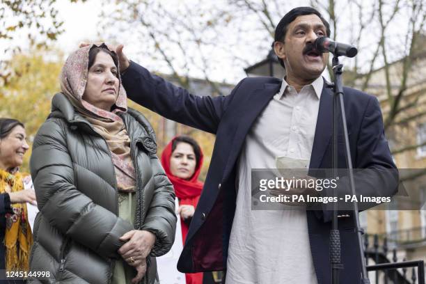 The father of Malala Yousafzai, Ziauddin Yousafzai, accompanied by his wife Toor Pekai Yousafzai, speaks during a rally in Westminster, London, for...