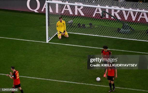 Belgium's goalkeeper Thibaut Courtois reacts after he conceided a goal shot by Morocco's midfielder Abdelhamid Sabiri during the Qatar 2022 World Cup...