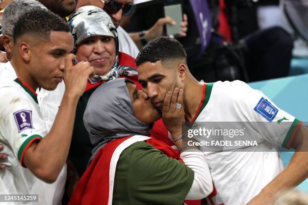 Morocco's defender Achraf Hakimi is greeted by his mother at the end of the Qatar 2022 World Cup Group F football match between Belgium and Morocco...