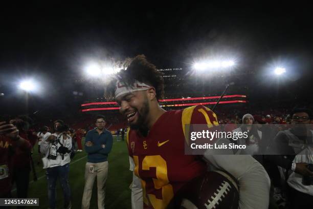 Quarterback Caleb Williams walks off the field after a 38-27 win against Notre dame in the storied football rivalry, held this year at the Los...