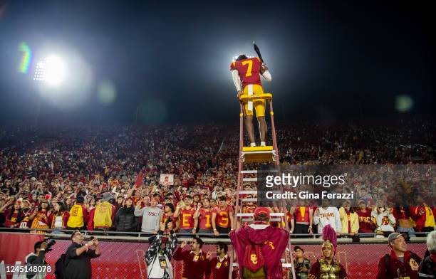 Trojans defensive back Calen Bullock celebrates with fans after beating Notre Dame at the Coliseum on November 26, 2022 in Los Angeles, California.