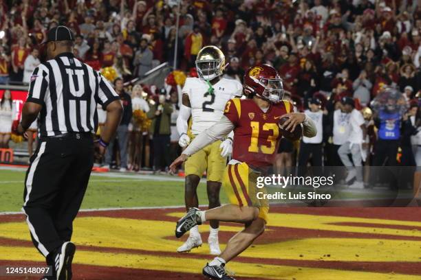 Quarterback Caleb Williams runs the ball into the end zone for a touchdown against Notre Dame in the second quarter of the storied football rivalry,...