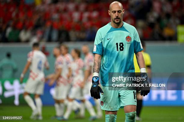 Canada's goalkeeper Milan Borjan looks down during the Qatar 2022 World Cup Group F football match between Croatia and Canada at the Khalifa...