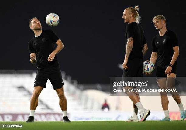 Denmark's midfielder Christian Eriksen , Denmark's defender Simon Kjaer and Denmark's defender Jens Stryger Larsen take part in a training session...