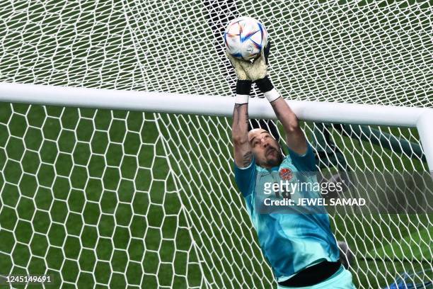 Canada's goalkeeper Milan Borjan catches the ball during the Qatar 2022 World Cup Group F football match between Croatia and Canada at the Khalifa...
