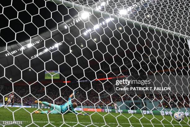 Canada's goalkeeper Milan Borjan concedes the second goal scored by Croatia's forward Marko Livaja during the Qatar 2022 World Cup Group F football...