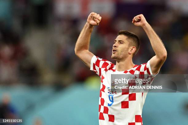 Croatia's forward Andrej Kramaric celebrates scoring his team's third goal during the Qatar 2022 World Cup Group F football match between Croatia and...