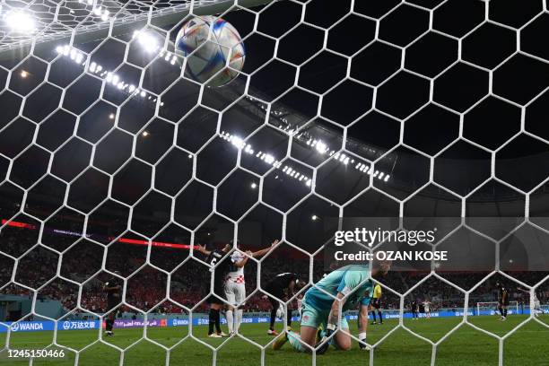 Canada's goalkeeper Milan Borjan concedes the third goal scored by Croatia's forward Andrej Kramaric during the Qatar 2022 World Cup Group F football...