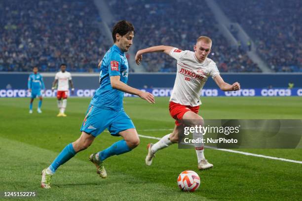 Daler Kuzyaev of Zenit St. Petersburg and Daniil Denisov of Spartak Moscow vie for the ball during the Russian Cup match between FC Zenit Saint...