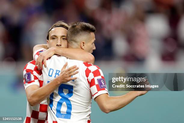 Lovro Majer of Croatia celebrates 4-1 with Mislav Orsic of Croatia during the World Cup match between Croatia v Canada at the Khalifa International...