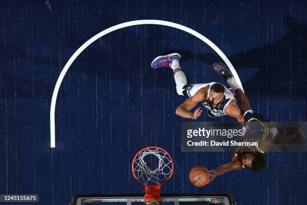 Andrew Wiggins of the Golden State Warriors dunks the ball during the game against the Minnesota Timberwolves on November 27, 2022 at Target Center...