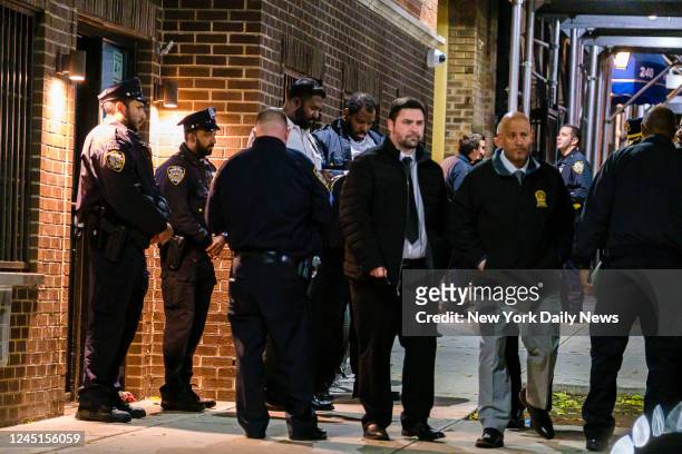 New York Police Department officers and detectives investigate the fatal stabbing of two young children at an apartment building on Echo Place in...
